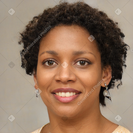 Joyful black young-adult female with short  brown hair and brown eyes