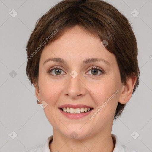 Joyful white young-adult female with short  brown hair and grey eyes