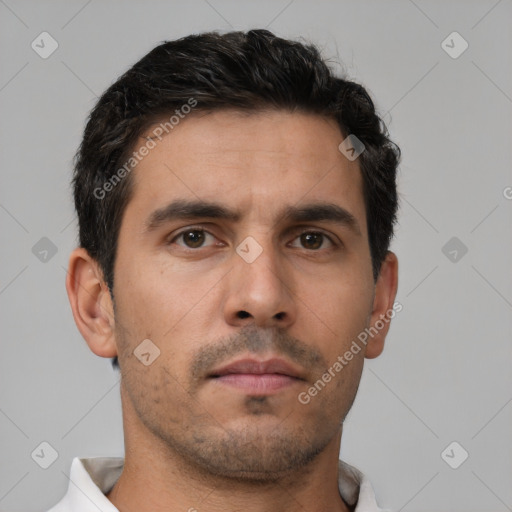 Neutral white young-adult male with short  brown hair and brown eyes