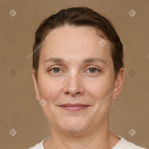 Joyful white adult female with short  brown hair and brown eyes