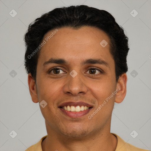 Joyful latino young-adult male with short  brown hair and brown eyes