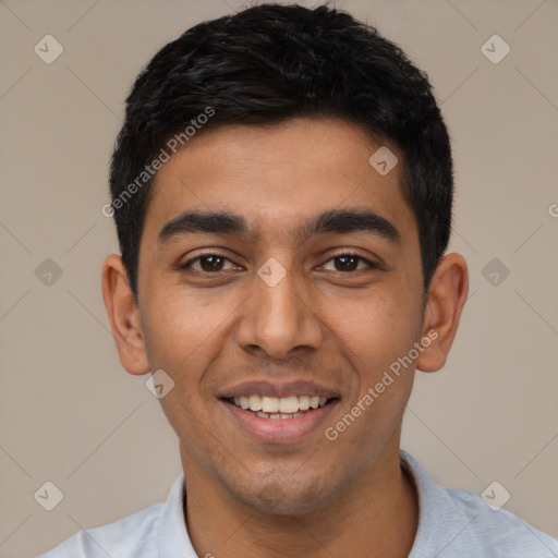 Joyful latino young-adult male with short  black hair and brown eyes