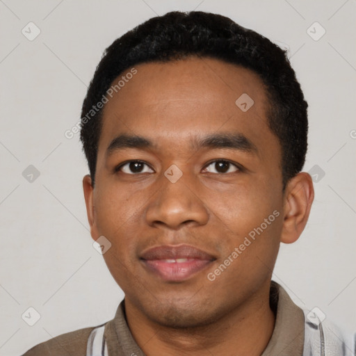 Joyful black young-adult male with short  black hair and brown eyes