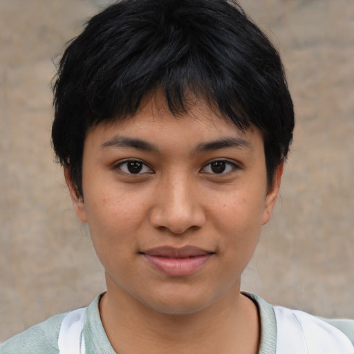 Joyful asian young-adult female with short  brown hair and brown eyes
