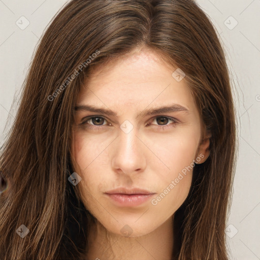 Neutral white young-adult female with long  brown hair and brown eyes