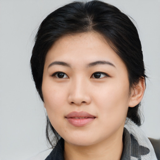 Neutral asian young-adult female with medium  black hair and brown eyes