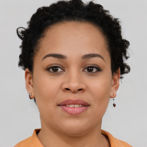 Joyful latino young-adult female with short  brown hair and brown eyes