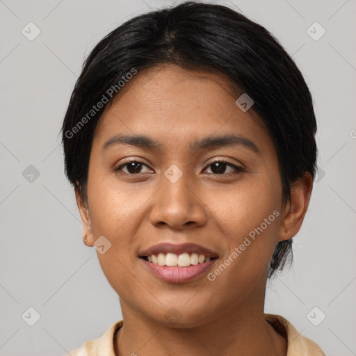 Joyful latino young-adult female with short  black hair and brown eyes