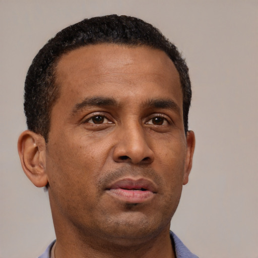 Neutral black young-adult male with short  brown hair and brown eyes