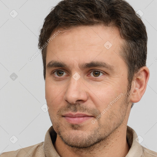 Joyful white adult male with short  brown hair and brown eyes