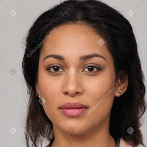 Joyful latino young-adult female with long  brown hair and brown eyes