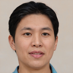 Joyful asian young-adult male with short  brown hair and brown eyes