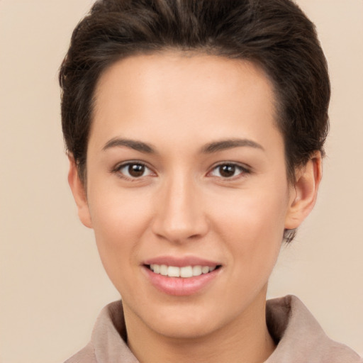 Joyful white young-adult female with short  brown hair and brown eyes