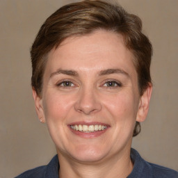 Joyful white adult female with short  brown hair and brown eyes