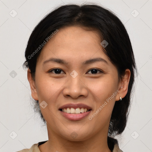 Joyful asian young-adult female with medium  brown hair and brown eyes