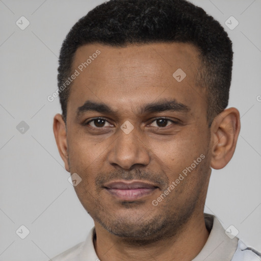 Joyful latino young-adult male with short  black hair and brown eyes