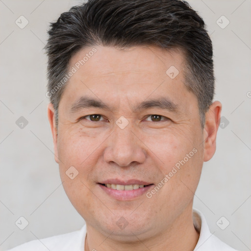 Joyful white adult male with short  brown hair and brown eyes