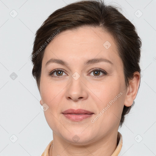 Joyful white adult female with short  brown hair and brown eyes