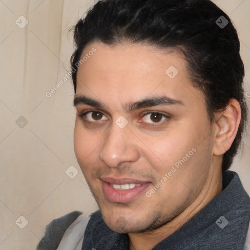 Joyful white young-adult male with short  black hair and brown eyes