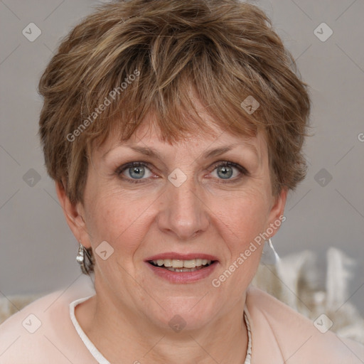 Joyful white adult female with short  brown hair and grey eyes