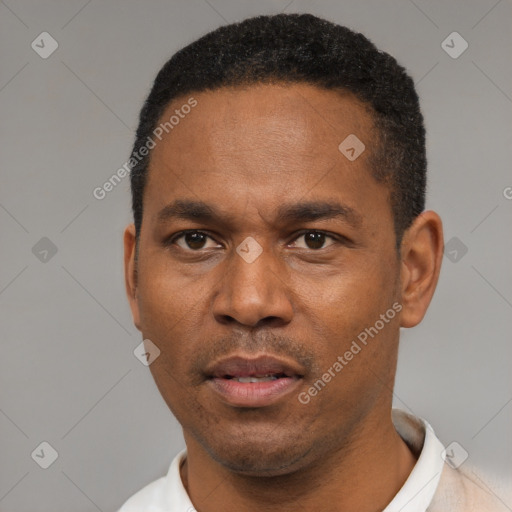 Neutral latino young-adult male with short  black hair and brown eyes