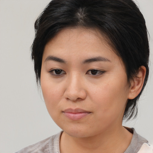 Neutral asian young-adult female with medium  black hair and brown eyes