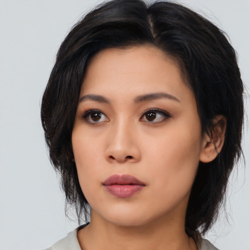 Neutral asian young-adult female with medium  black hair and brown eyes