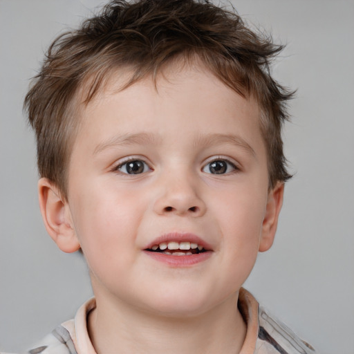 Joyful white child male with short  brown hair and brown eyes