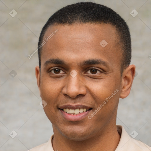 Joyful latino young-adult male with short  brown hair and brown eyes