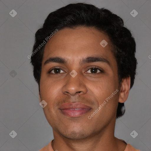 Joyful latino young-adult male with short  brown hair and brown eyes