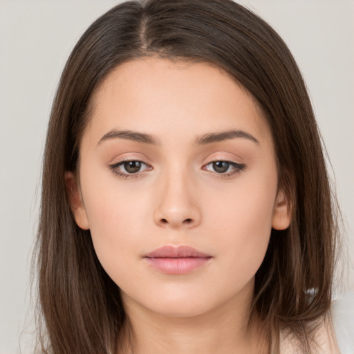 Neutral white young-adult female with long  brown hair and brown eyes