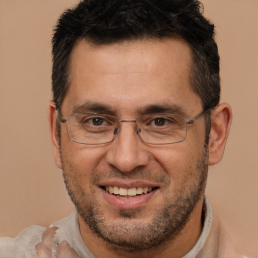 Joyful white adult male with short  brown hair and brown eyes