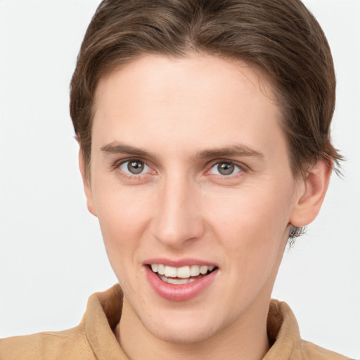 Joyful white young-adult female with short  brown hair and grey eyes