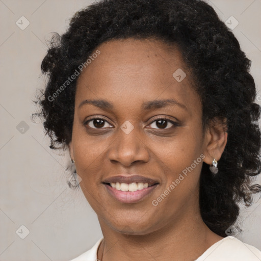 Joyful black young-adult female with medium  black hair and brown eyes