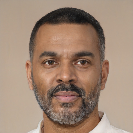 Neutral latino adult male with short  black hair and brown eyes