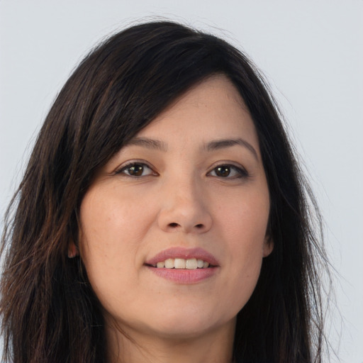 Joyful asian young-adult female with long  brown hair and brown eyes