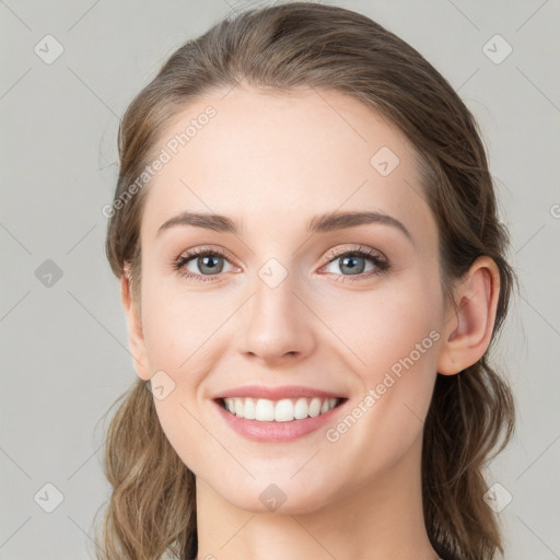 Joyful white young-adult female with medium  brown hair and green eyes