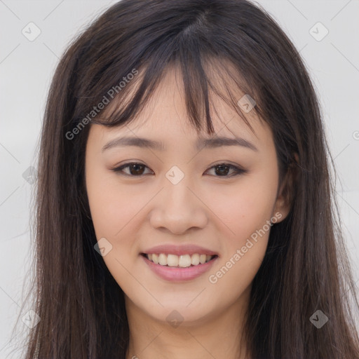 Joyful asian young-adult female with long  brown hair and brown eyes