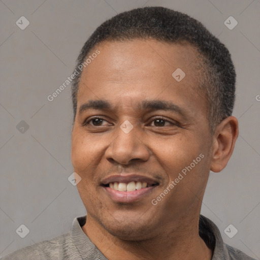 Joyful latino adult male with short  black hair and brown eyes