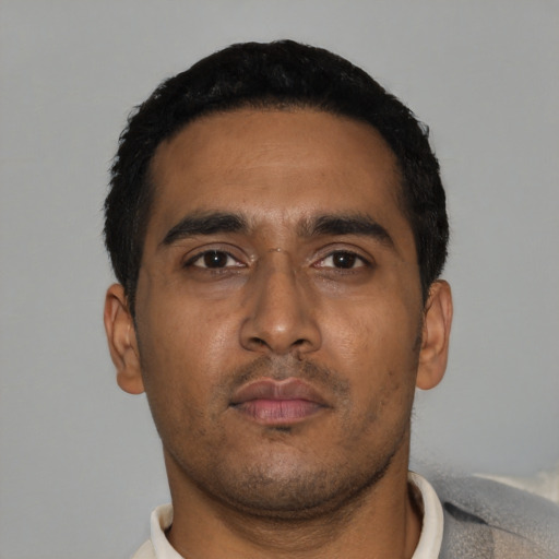 Neutral latino young-adult male with short  black hair and brown eyes