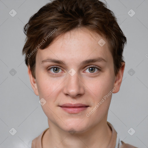 Joyful white young-adult female with short  brown hair and grey eyes