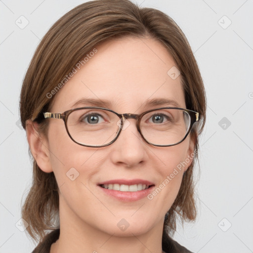 Joyful white adult female with medium  brown hair and blue eyes