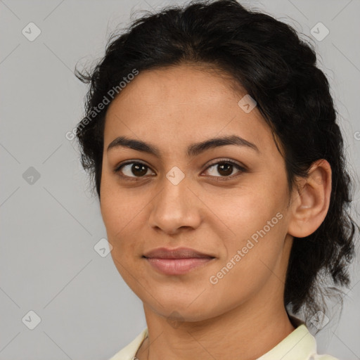 Joyful latino young-adult female with medium  brown hair and brown eyes