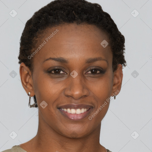 Joyful black young-adult female with short  brown hair and brown eyes