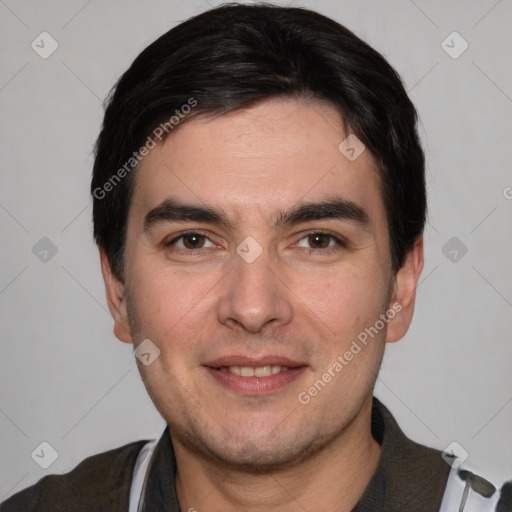 Joyful white young-adult male with short  black hair and brown eyes