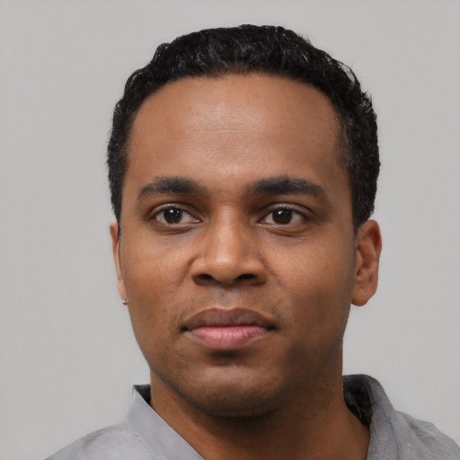 Neutral black young-adult male with short  black hair and brown eyes