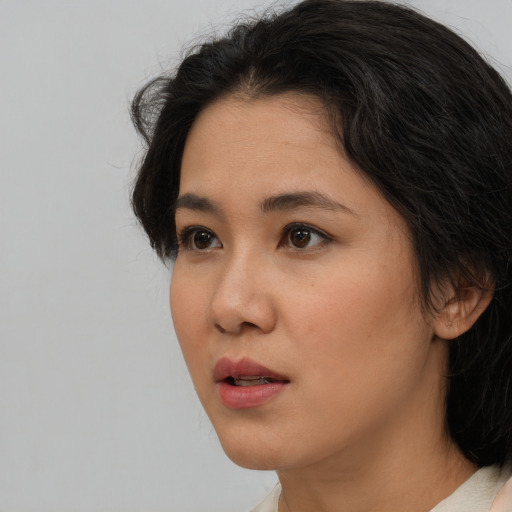Neutral asian young-adult female with medium  brown hair and brown eyes