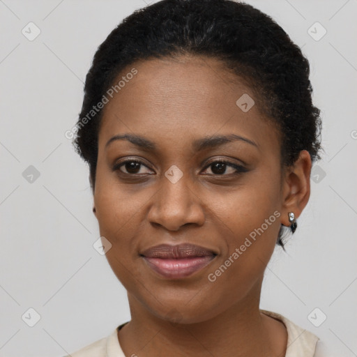 Joyful black young-adult female with short  brown hair and brown eyes