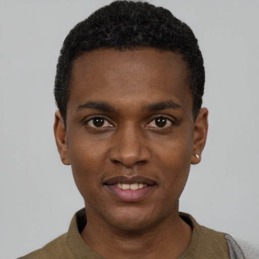 Joyful black young-adult male with short  black hair and brown eyes