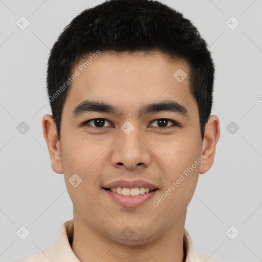 Joyful latino young-adult male with short  brown hair and brown eyes